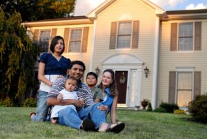 family on front lawn