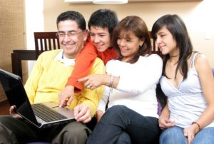 family looking at a computer