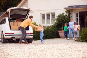 family unpacking car